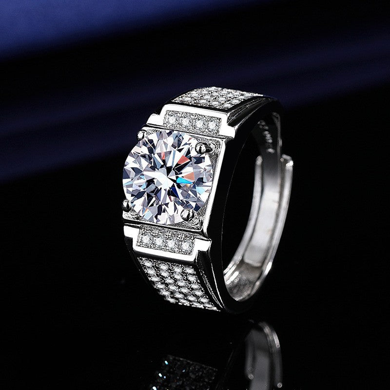 Silver halo engagement ring with a large brilliant-cut center crystal surrounded by a cluster of smaller sparkling stones on a dark background.