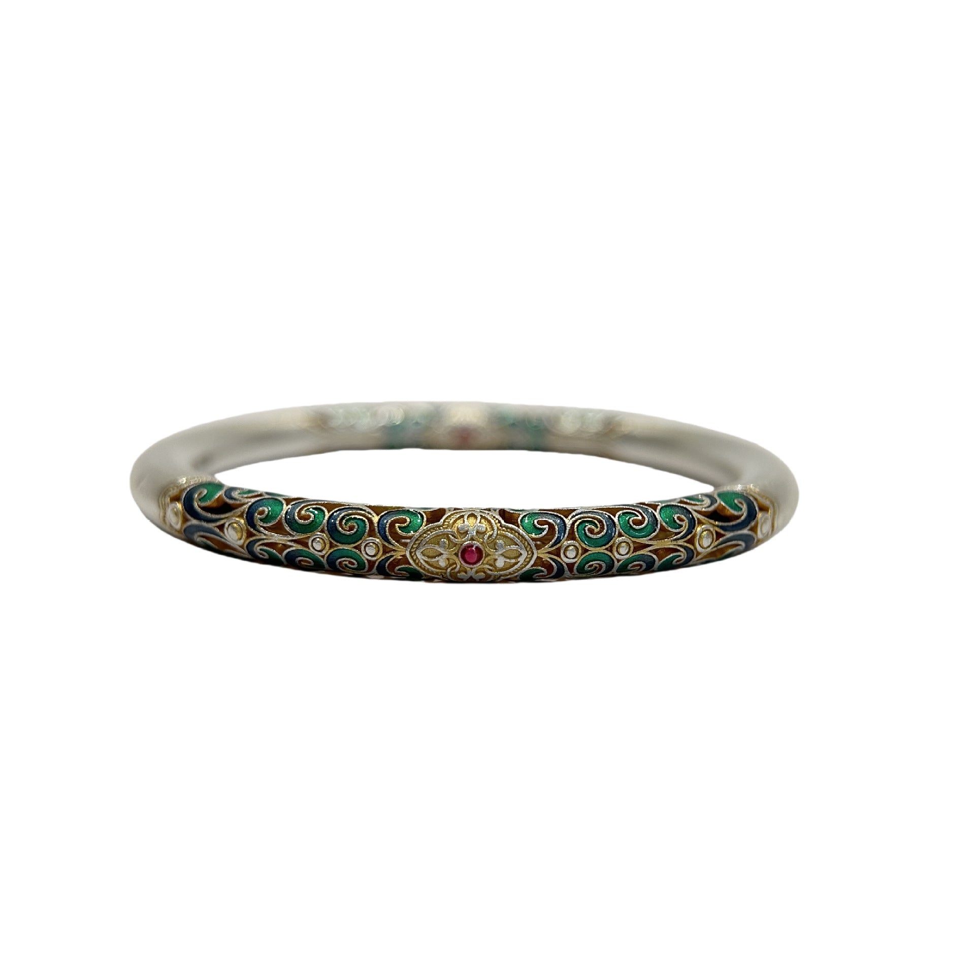 Hand holding a thick silver bangle with intricate colorful enamel scrollwork in shades of green, blue, and gold.